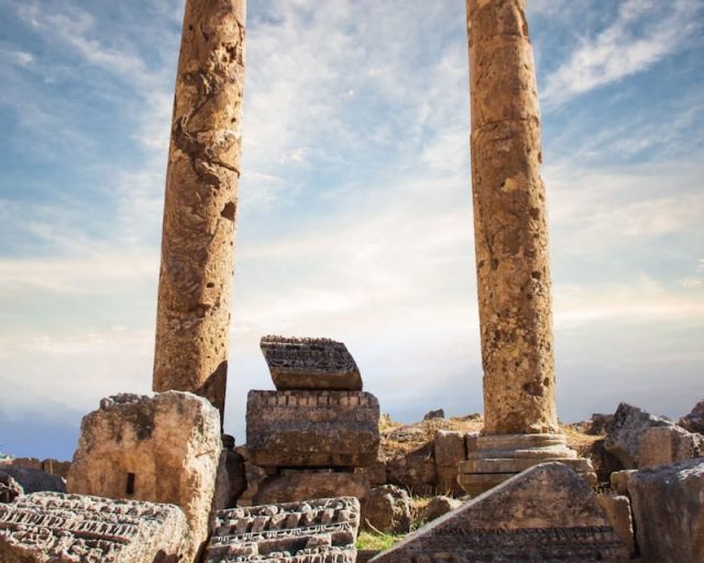 brown and gray concrete pillar under blue sky during daytime